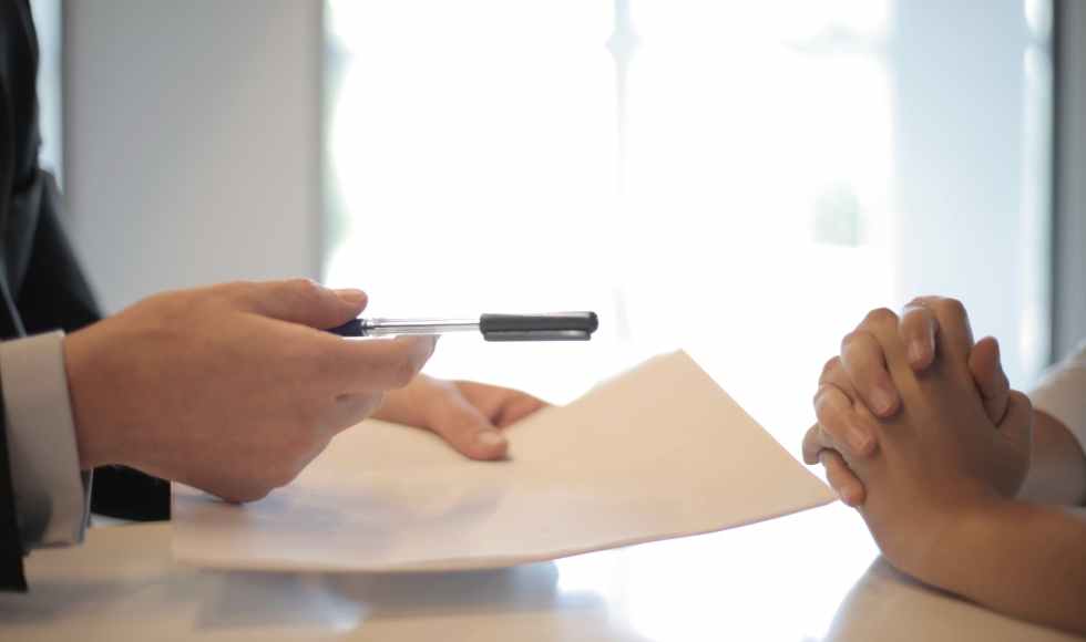 crop businessman giving contract to woman to sign