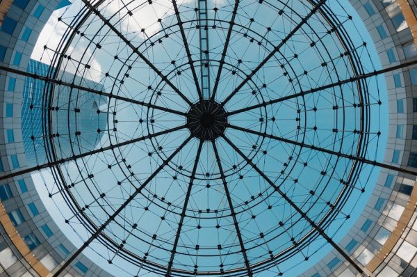 low angle photography of glass ceiling